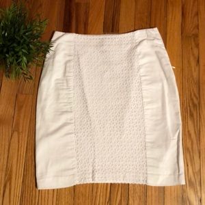 White skirt with lace detail, fully lined.